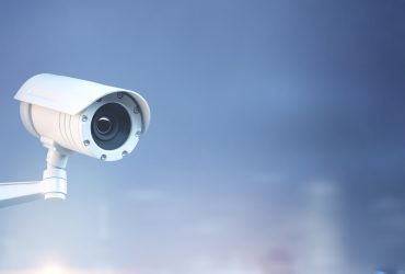 Modern CCTV camera on a wall